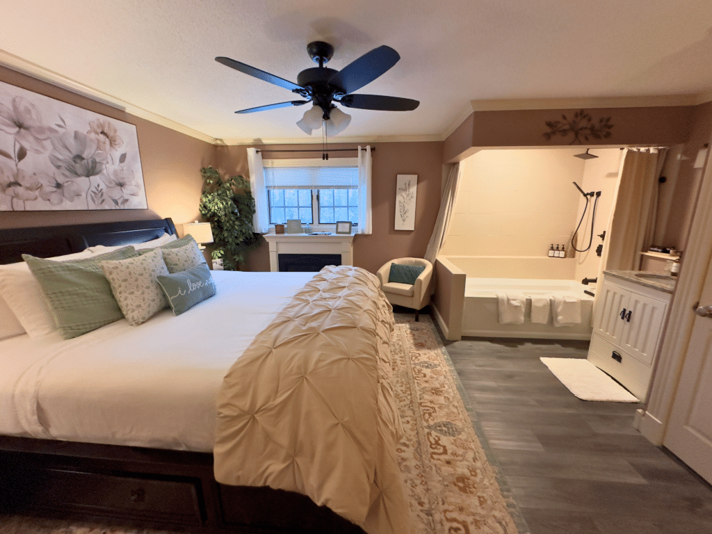 Solitude full view of king bed and Kohler Air Jet Tub